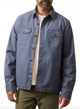 Load image into Gallery viewer, Man wearing a blue jacket over a white shirt on a white background