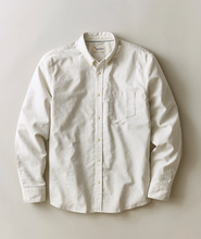 Load image into Gallery viewer, A long-sleeve button-down shirt in a cream and white micro-geometric stripe pattern, laid flat against a neutral light gray background.