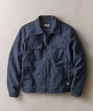 Load image into Gallery viewer, A navy zip up jacket laid flat on a plain white background