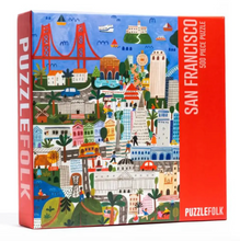 Load image into Gallery viewer, PuzzleFolk San Francisco 500-piece jigsaw puzzle box, featuring a colorful, detailed cartoon-style illustration of the city on the front and a bright red side panel with white text.