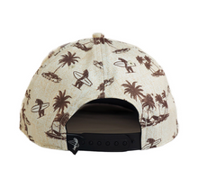 Load image into Gallery viewer, Back view of a snapback cap featuring a brown palm tree and surfer pattern on a cream-colored textured fabric, with a black adjustable strap.