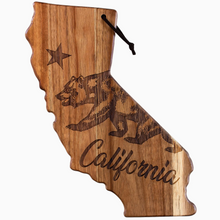 Load image into Gallery viewer, A wooden California-shaped wall hanging with a natural wood grain finish, featuring an engraved grizzly bear, a star, and the word 'California' in script. A black hanging loop is attached at the top, shown against a plain white background.
