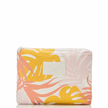Load image into Gallery viewer, A rectangular zippered pouch featuring a tropical leaf pattern in yellow, orange, and pink on a white background, with a white brand patch on the front.