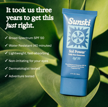 Load image into Gallery viewer, Sunski Sol Power sunscreen tube on a leaf with product features listed.