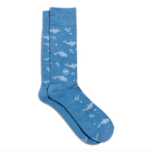 Load image into Gallery viewer, A pair of heathered blue crew socks with a white underwater print of dolphins and sea plants, displayed on a clean white background.
