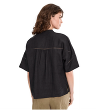 Load image into Gallery viewer, Black linen top with delicate cutout texture details, back view
