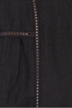 Load image into Gallery viewer, Close-up of a black garment with decorative stitching detail
