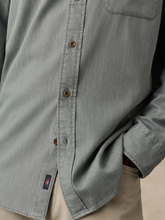 Load image into Gallery viewer, Detail shot of buttons on the front of a sage green collared shirt

