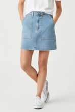 Load image into Gallery viewer, Woman wearing light wash denim skirt with a white tee and sneakers
