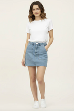 Load image into Gallery viewer, Woman wearing light wash denim skirt with a white tee and sneakers
