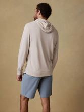 Load image into Gallery viewer, Man wearing a beige hoodie and light blue shorts on a beige background
