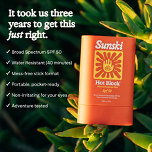 Load image into Gallery viewer, Sunski Hot Block SPF 50 stick on a green leafy background with product features listed.
