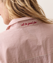 Load image into Gallery viewer, Back neck detail of a striped poplin shirt with the words 'all in good fun' embroidered in red on the back neck under the collar 
