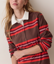 Load image into Gallery viewer, A woman wearing a brown long-sleeve collared shirt with brown, red and white horizontal stripes, styled over a white undershirt.
